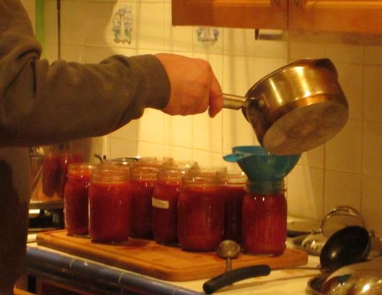 Pete pours the first round of what's probably the last batch of the season's tomato sauce. Next stop on our mad spree: apples.