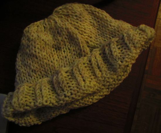 In the coldest, darkest weeks of last winter, the soup kitchen asked for hats, scarves and gloves. It seemed like a super-constructive idea to learn how to knit a hat, but I'm still a terrible knitter. Technically, this is a hat, though it looks like a bowling ball cozy. I don't want bowling balls to be cold, either. I guess.
