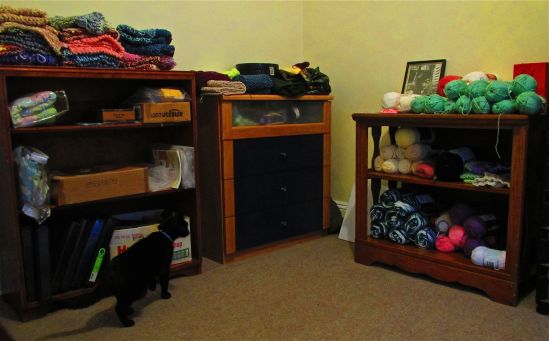 The Drusy-approved project room is a work in progress. On the left, cat blankets; center, scarves and hats for whichever project asks; on the right, loosely organized ideas and a photo of my grandfather from The Gang That Couldn't Shoot Straight. This evening, I accidentally shut Wednesday in this room by accident, a foible of which Drusy also approved.